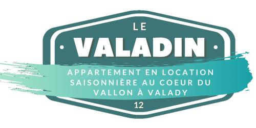 a sign that reads la valtion with a blue ribbon at Le Valadin in Valady