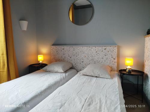 Ένα ή περισσότερα κρεβάτια σε δωμάτιο στο Le Sarciron 152