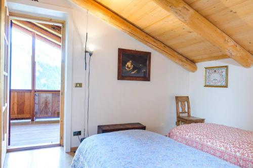 Postel nebo postele na pokoji v ubytování Chalet Monciòn
