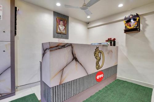 a room with a wall with a monkey painted on it at Hotel O Dhiman Residency in Mumbai