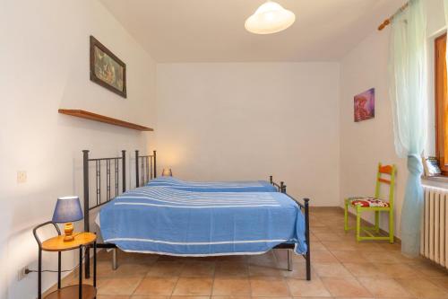 Ένα ή περισσότερα κρεβάτια σε δωμάτιο στο Poggio dei Michelazzi Fauglia