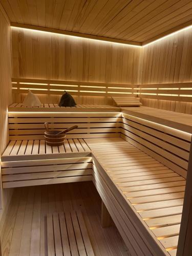 a sauna with a cat sitting in the middle at Jantar Domki Comfort oraz Comfort Wellness Zone sauna jacuzzi in Jantar
