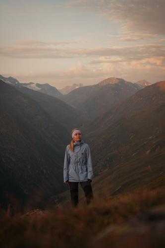 a woman standing on top of a mountain at Hotel Macun, Vent im Ötztal in Vent