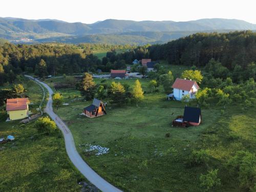 an aerial view of a village with tents and a road at A Pine vikendica u srcu Zapadne Srbije in Nova Varoš