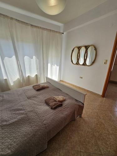 Ένα ή περισσότερα κρεβάτια σε δωμάτιο στο Sweet Dreams Villa