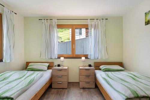 Ένα ή περισσότερα κρεβάτια σε δωμάτιο στο Appartment Waldblick Mühlenbach