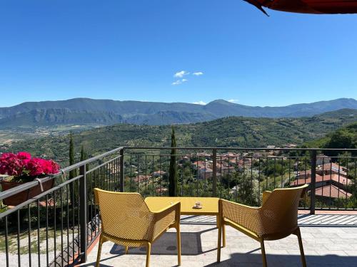 a table and chairs on a balcony with a view at B&B Albachiara Casa di Campagna in Ogliastro Cilento
