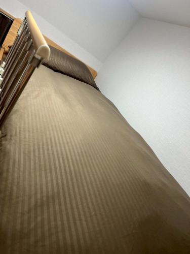 Letto o letti in una camera di Issyuku Hotel Kotobuki Sanchome