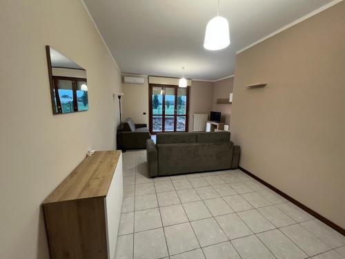 a living room with a couch and a table at Casa Girasole in Bertonico
