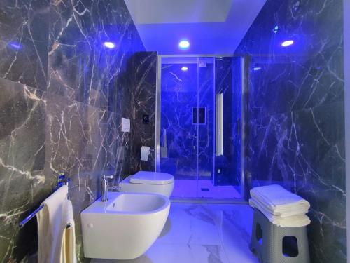 a bathroom with a toilet and a sink and a shower at B&B Ilary Tropea in Tropea