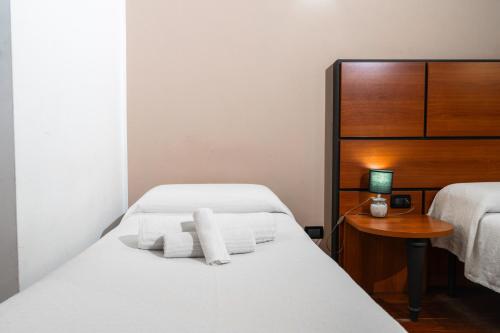 Postel nebo postele na pokoji v ubytování Hotel City Center