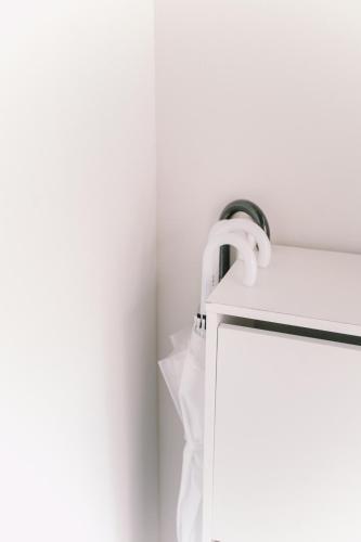 a white towel hanging on a towel rack at 6 minutes walk from Ichikawa Station Single-family house with 3 bedrooms and 1 living room Rich living facilities around in Ichikawa
