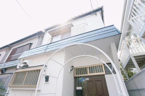 an archway over the door of a building at 6 minutes walk from Ichikawa Station Single-family house with 3 bedrooms and 1 living room Rich living facilities around in Ichikawa