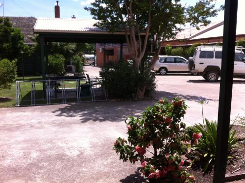 a parking lot with a gate in front of a building at Mansfield Travellers Lodge in Mansfield