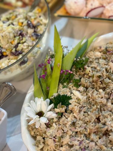a table with a plate of food with flowers in it at DW Atrium in Polańczyk