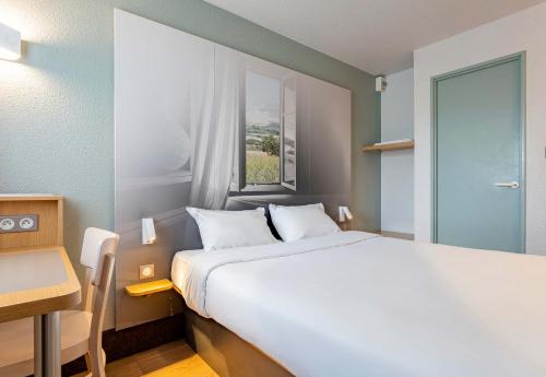 Postel nebo postele na pokoji v ubytování B&B HOTEL Boulogne-sur-Mer Saint-Martin