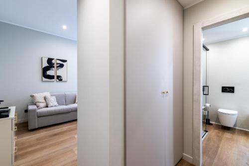 a living room with a couch and a window at Residenza Le Terrazze in Alassio