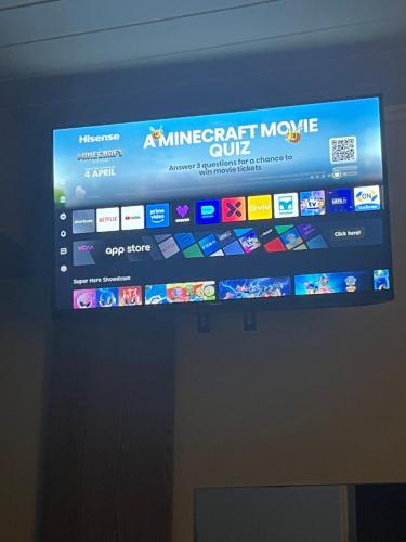 a television screen with a microsoft movie on it at Stylish OceanBreeze 50 Central Mossel Bay in Mossel Bay