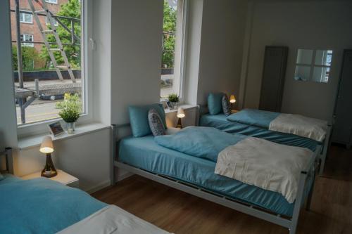 Ένα ή περισσότερα κρεβάτια σε δωμάτιο στο Förde Apartments Kiel