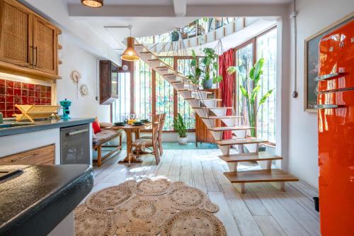 a kitchen with a spiral staircase in a room at Boheme House with Bathtub & Terrace in Istanbul