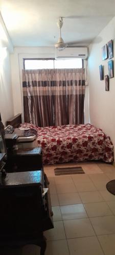 a bedroom with a bed and a window at pradeepa villa in Colombo