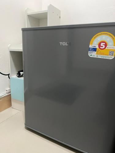 a refrigerator with a sticker on the side of it at La Locanda in Bangkok