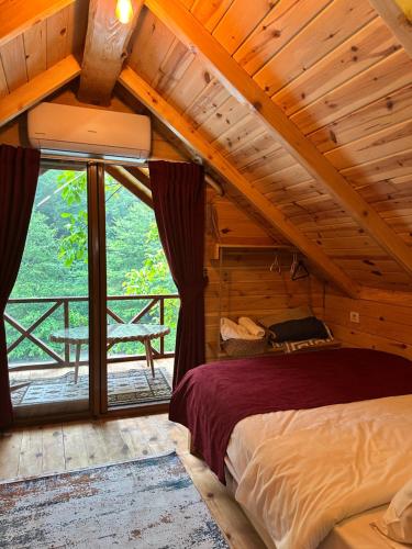 A bed or beds in a room at Nehir Bungalows