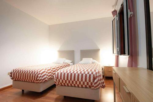 Ένα ή περισσότερα κρεβάτια σε δωμάτιο στο Casa reizinho