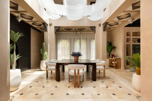 a dining room with a table and chairs at Marrakech Villa with Private Pool & Family-Friendly in Marrakesh