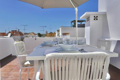 Escape to a terrace over Tavira's history
