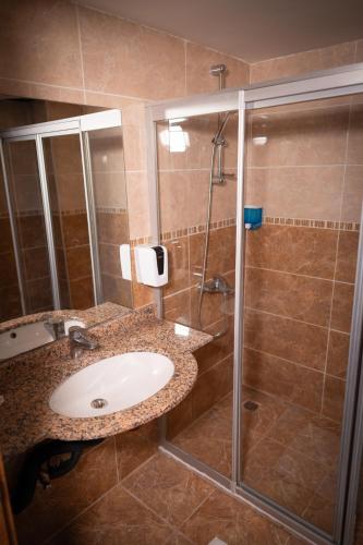 a bathroom with a sink and a shower at Club Golf Hotel All Inclusive in Side