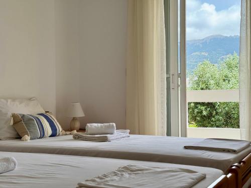 A bed or beds in a room at Panoramic View, House, at Zipari Village "2"