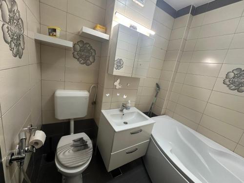 Koupelna v ubytování Louisa Apartament