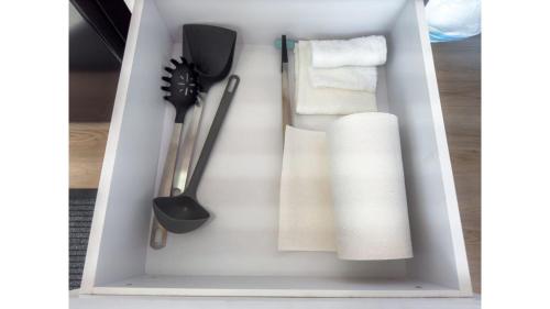 a white box with some utensils in it at Hill River Nature Reserve by Tiny Away in Jurien Bay