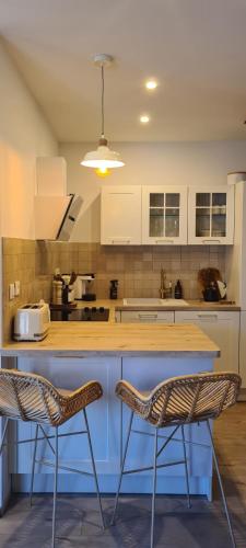 Køkken eller tekøkken på Appartement Cozy avec Clim, Balcon et Parking Gratuit