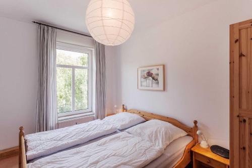 Postel nebo postele na pokoji v ubytování Ferienwohnung Alter Dorfkrug 3