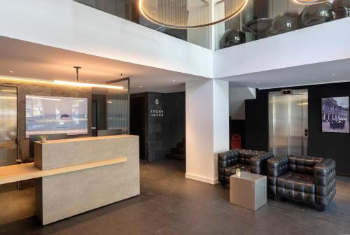 a living room with a couch and a television at HM Jaime III in Palma de Mallorca