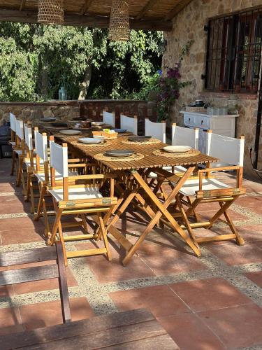 a wooden table and chairs sitting on a patio at B&B La Vista Brava in Platja  d'Aro