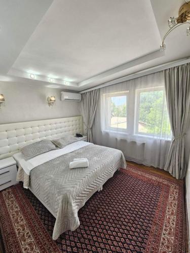 Postel nebo postele na pokoji v ubytování Bella Donna Hotel