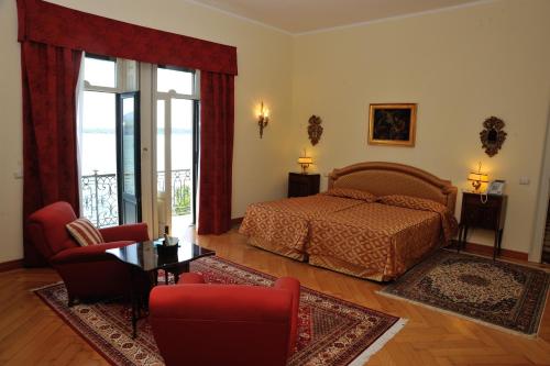 a bedroom with a bed and a living room at Villa Claudia dei Marchesi Dal Pozzo in Belgirate