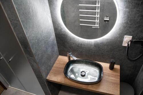 a bathroom with a sink and a mirror at hotel Dobruška in Dobruška