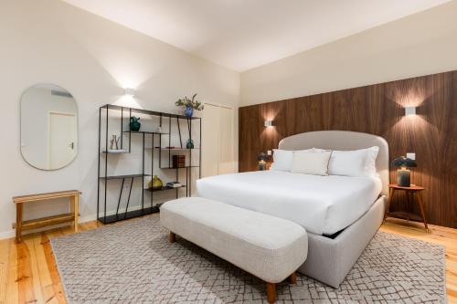 Postel nebo postele na pokoji v ubytování Albertina Carlos Alberto by Aspasios