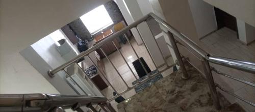 a view of a staircase in a house at EmeraldSuites Blossom Court Alalubosa GRA in Ibadan