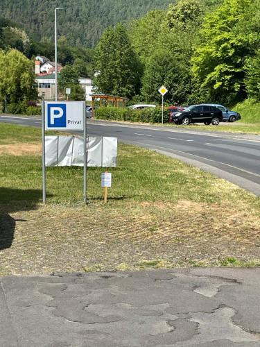 a parking sign on the side of a road at Klosterhof Neustadt am Main in Neustadt am Main