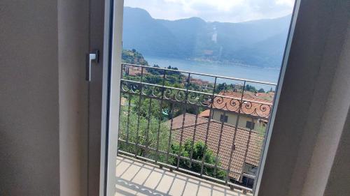 a view from a balcony with a view of a building at Vista Lago Como in Ossuccio