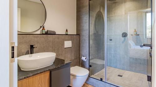 a bathroom with a sink and a shower at Table Mountain View Apartment in Cape Town