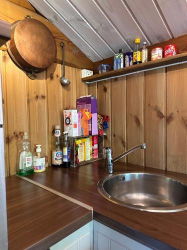 a kitchen with a sink and a wooden counter top at Holiday cabin, Kristianplass at Bjorli, Lesja in Bjorli