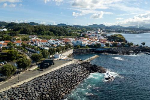 an aerial view of a town next to the water at Casa dos Santos in Ponta Delgada