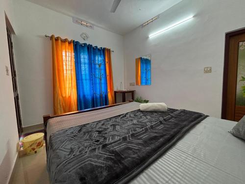 Cama o camas de una habitación en Homestay INN Munnar