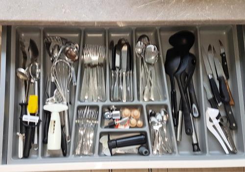 a drawer filled with utensils and other kitchen items at BoBi - 2 Schlafzimmer, Balkon, W-Lan, Parkplatz in Dortmund